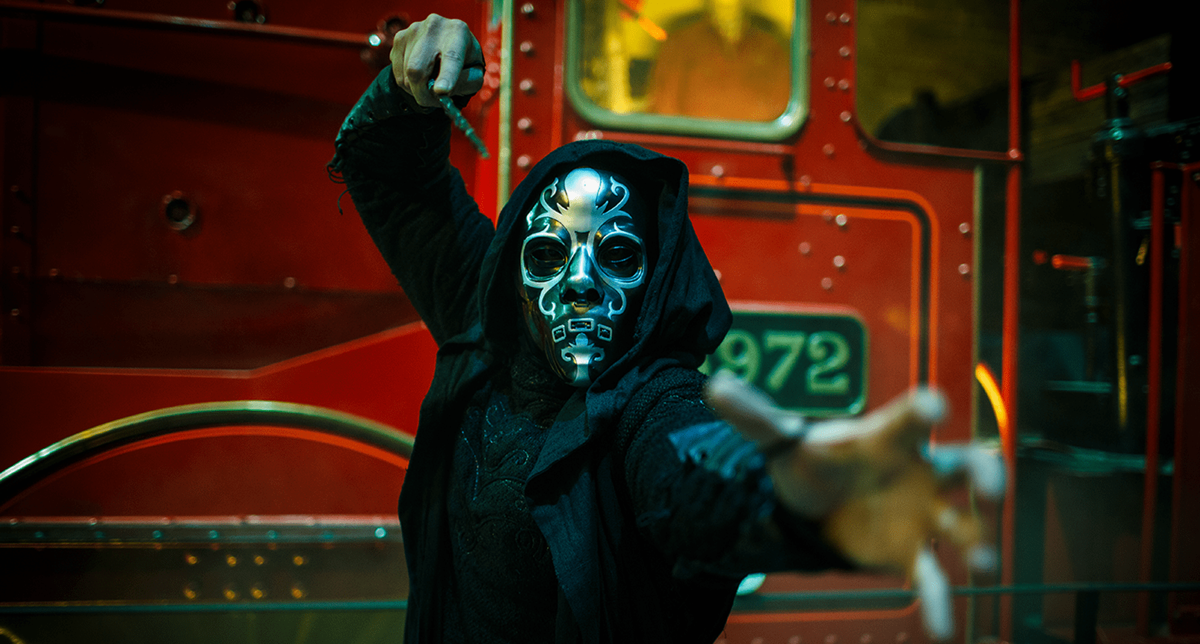 A Death Eater in front of the Hogwarts Express