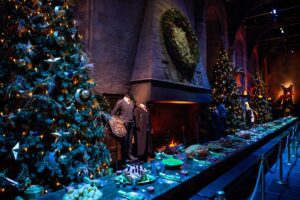 Christmas trees, a festive wreath and a Christmas feast in the Great Hall set