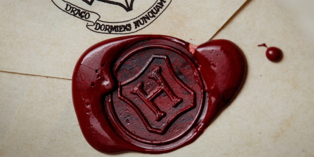 H stamped on Hogwarts Letter extreme close up